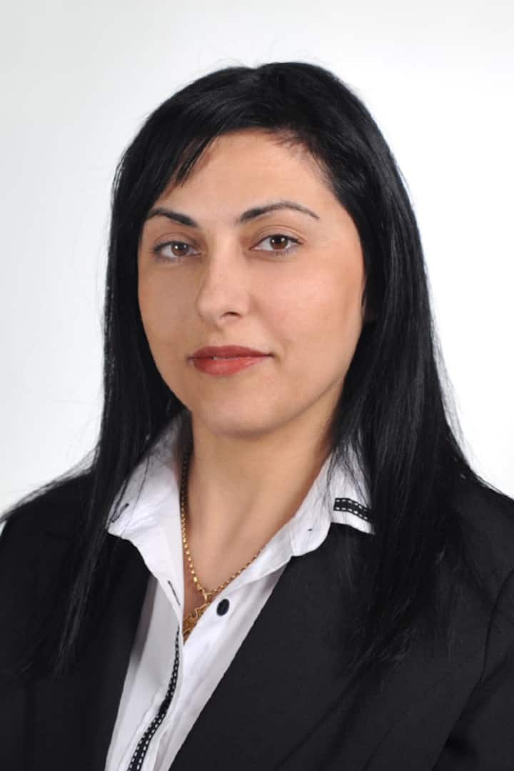 Gina, your host at OliveVine Luxury Apartments